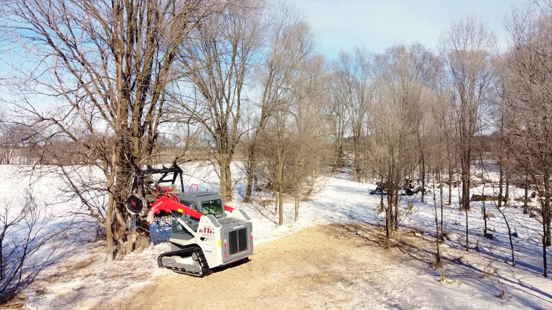 Aerial view of Takeuchi forestry mulcher clearing trees on a Wisconsin property