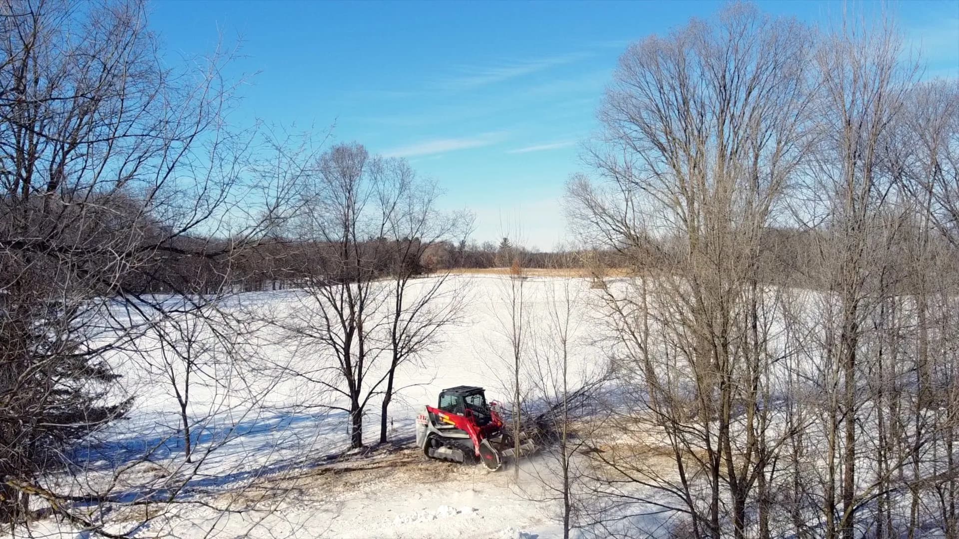 Aerial view of forestry mulching equipment clearing land in central Wisconsin